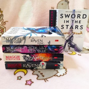 the raven cycle book stack with sword in the stars book cover